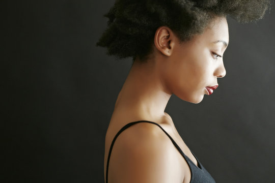 Close Up Profile Of Black Woman Looking Down