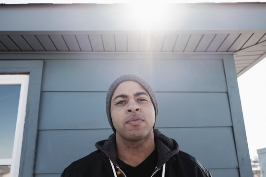 Close up of mixed race man frowning outdoors