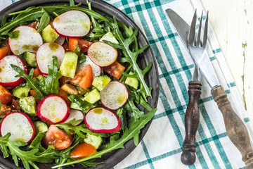 Vegetable salad on wooden background
