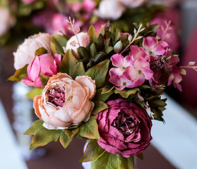 Colorful bouquet with peonies and hydrangea, wedding decoration with artificial flowers