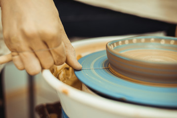 man working on a potter's wheel