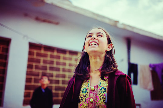 Girl looking up and laughing