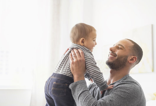 Young Father Holding Baby Son