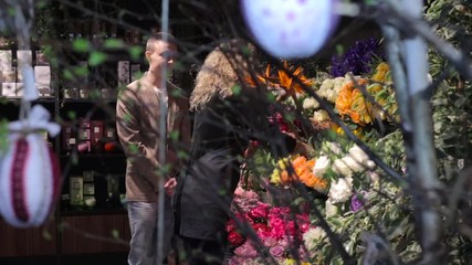 Florist consultation - man chooses the flowers for a bouquet in shop