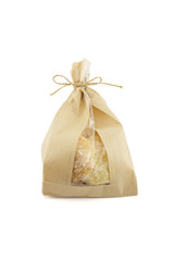 Bag of fresh cookies on white background