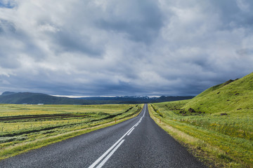 road in dramatic landscape, travel concept, beautiful scenery of Iceland