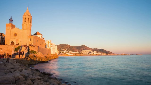 sunset bay church of sant bartomeu and santa tecla 4k time lapse sitges spain
