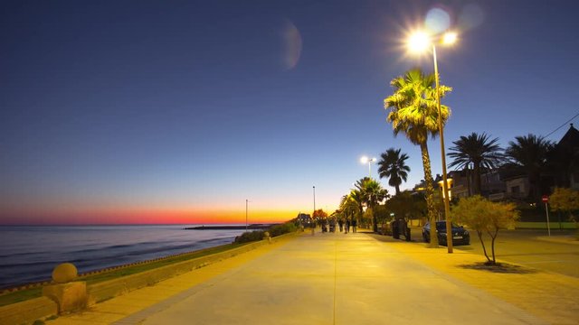 sunset light sitges mediterranean sea walking bay 4k time lapse spain
