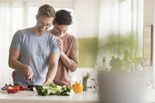 Couple cooking in kitchen