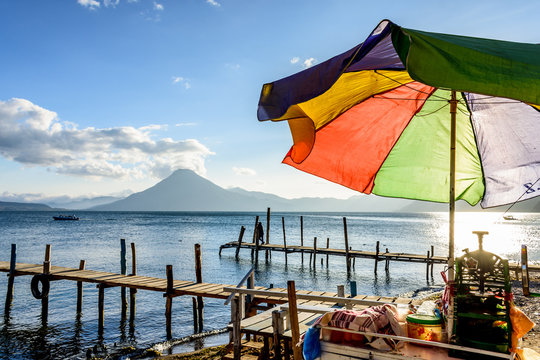 Colorful umbrella & San Pedro volcano at Lake Atitlan, Guatemala
