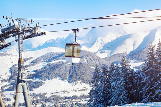 skiing in Alps, ski lift cabine and beautiful mountain panoramic landscape