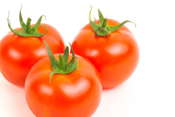 Ripe tomatoes isolated on a white background 