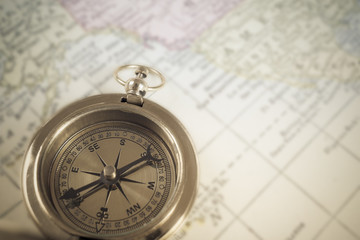 Compass on map background, use for travel concept