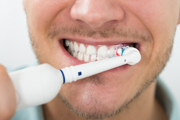 Man Teeth With Electric Toothbrush