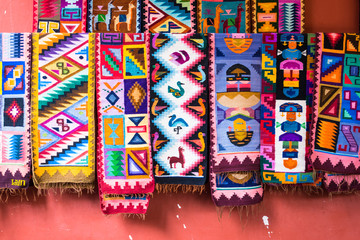 Colorful peruvian blanket for sale in the market as souvenir