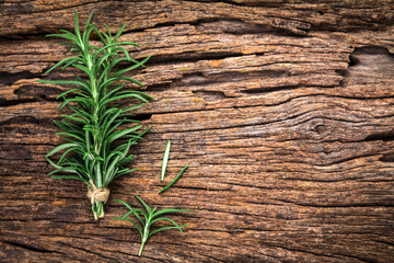 Fresh green Rosemary bound on a wooden board