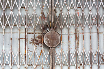 Old white metal door with lock