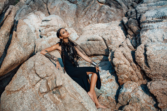young beautiful tribal girl on the rocks