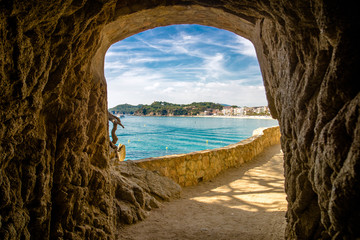 Views of Lloret de Mar over the grotto in the rock © licvin