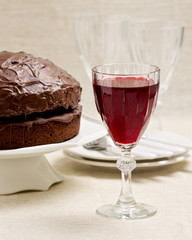 Chocolate cake and glasses of wine.