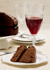 Chocolate cake and glasses of wine.