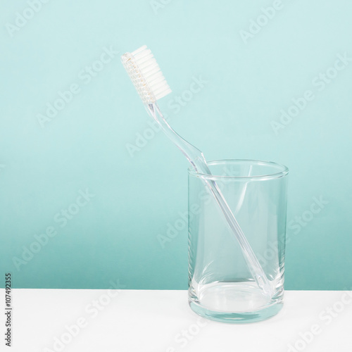 "The clear toothbrush with small glass for brushing the teeth." Stock