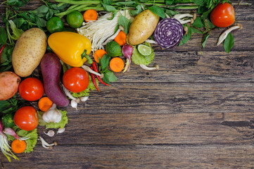 Fresh Vegetables on Wooden Background. Healthy Food. Vegetarian food, Organic Food. Vegetables on wooden table from above.