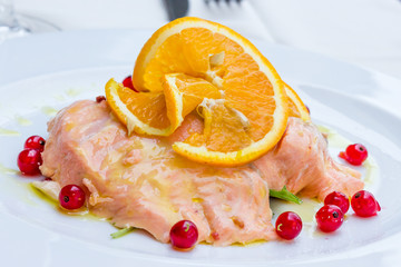 Salmon marinated into orange