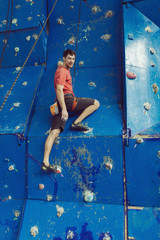 Fit man rock climbing