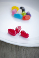coloured jellybeans on white plate
