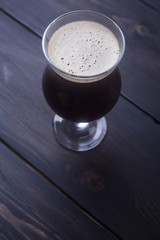 Dark ale on wood