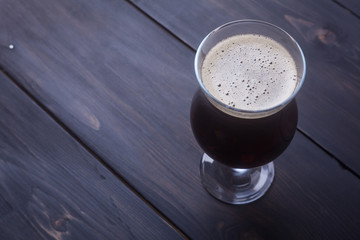 Dark ale on wood