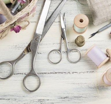 Scissors with set of reel of thread and thimble  for sewing and