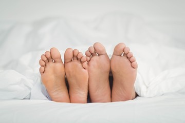 Feet sticking out from the blanket