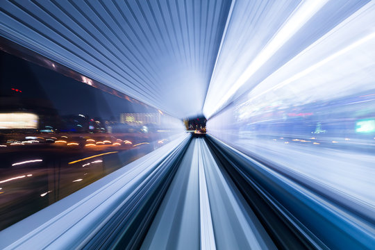 Light trail accelerating through a tunnel