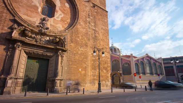 sun light valencia cathedral doors and market building 4k time lapse spain
