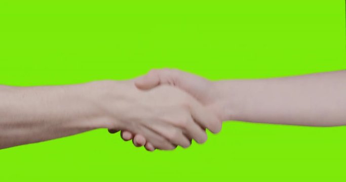 adult male and teen female hands handshake over green screen, 4k prores hq footage