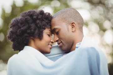 Peaceful couple standing nose to nose