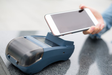Customer using cellphone to pay