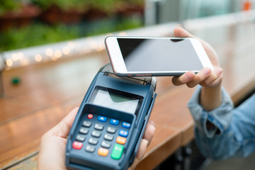 Woman use of mobile phone to pay
