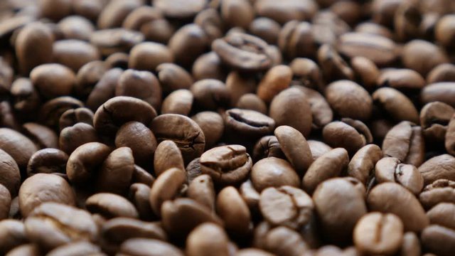 Whole arabica coffee beans shallow DOF 4K 2160p UHD footage - Slow tilting over coffee beans arabic type background 4K 3840X2160 UlraHD video 