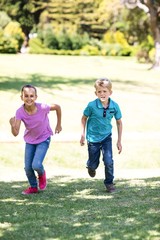 Siblings with running in park
