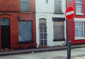A street of boarded up derelict houses awaiting regeneration in Liverpool UK