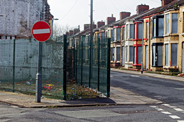 A street of boarded up derelict houses awaiting regeneration in Liverpool UK