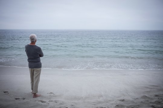 Rear View Of Senior Man Looking At Sea