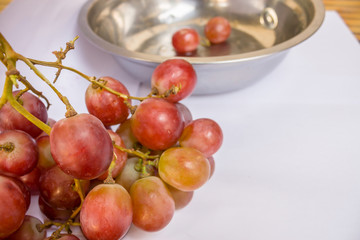 Close-Up Of Red Grape / Close-Up Of Red Grape With Stainless Steel Basin On White.
