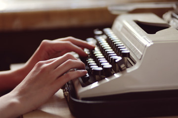 typewriter with hands 