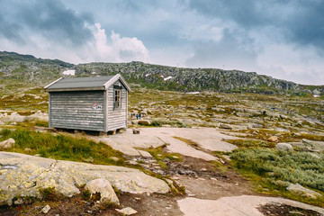 Norwegian mountains landscape. Old wooden house. Travel and hiki