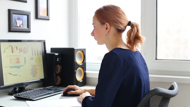 Woman working with computer in office