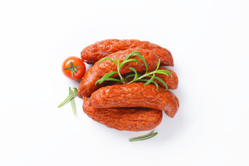 Kielbasa sausages on white background